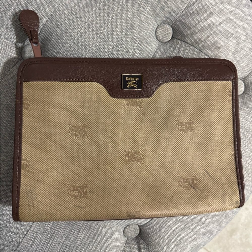 Burberry  Burberry’s pouch jacquard coated canvas and leather